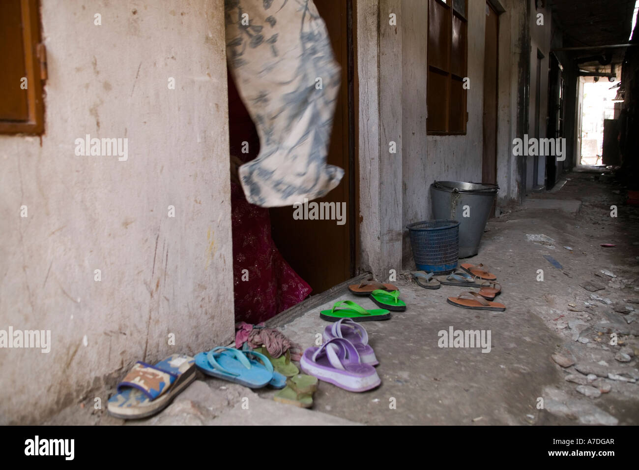 Shoes left outside the entrance to this home in Dhaka Bangladesh Stock