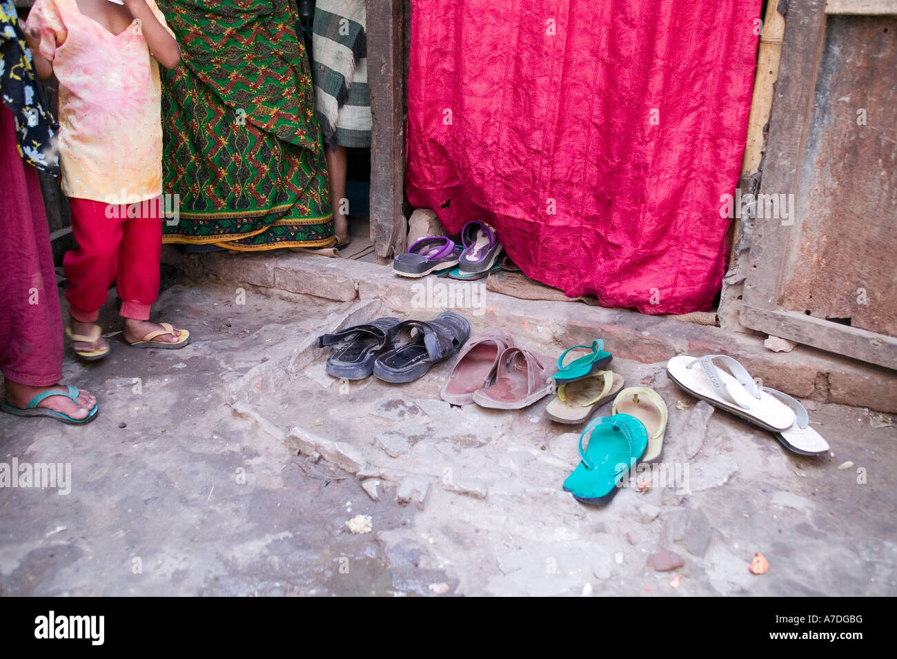 Shoes left outside the entrance to this home in Dhaka Bangladesh Stock