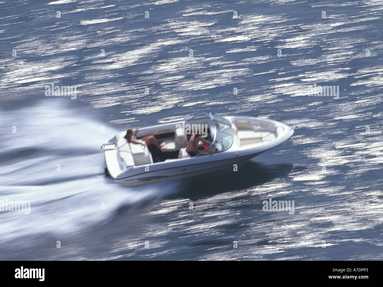 Speedboat racing across water Devon England Stock Photo