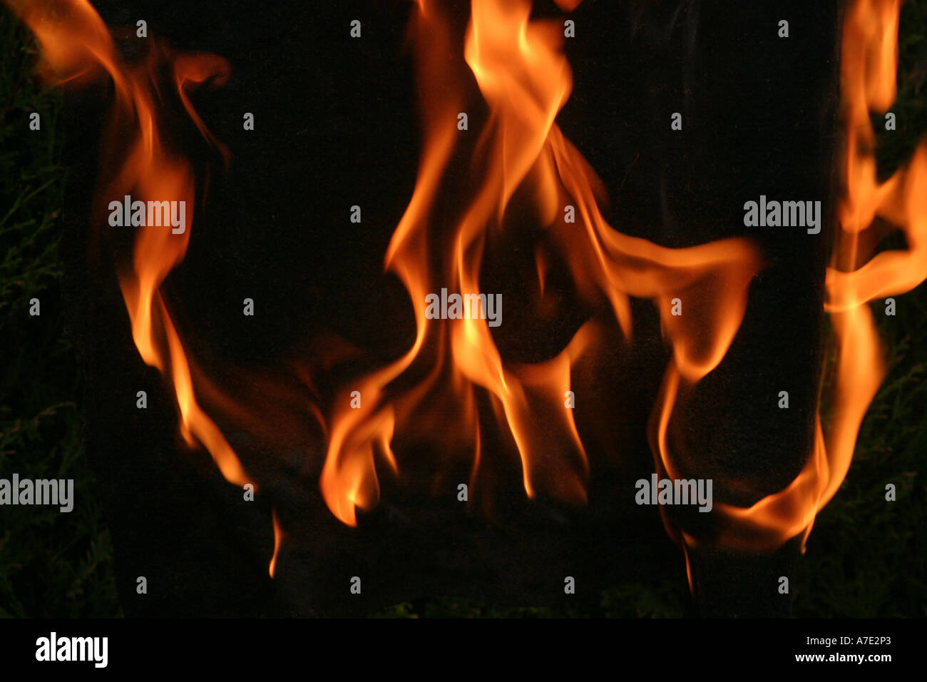 Orange Flames against a black background Stock Photo