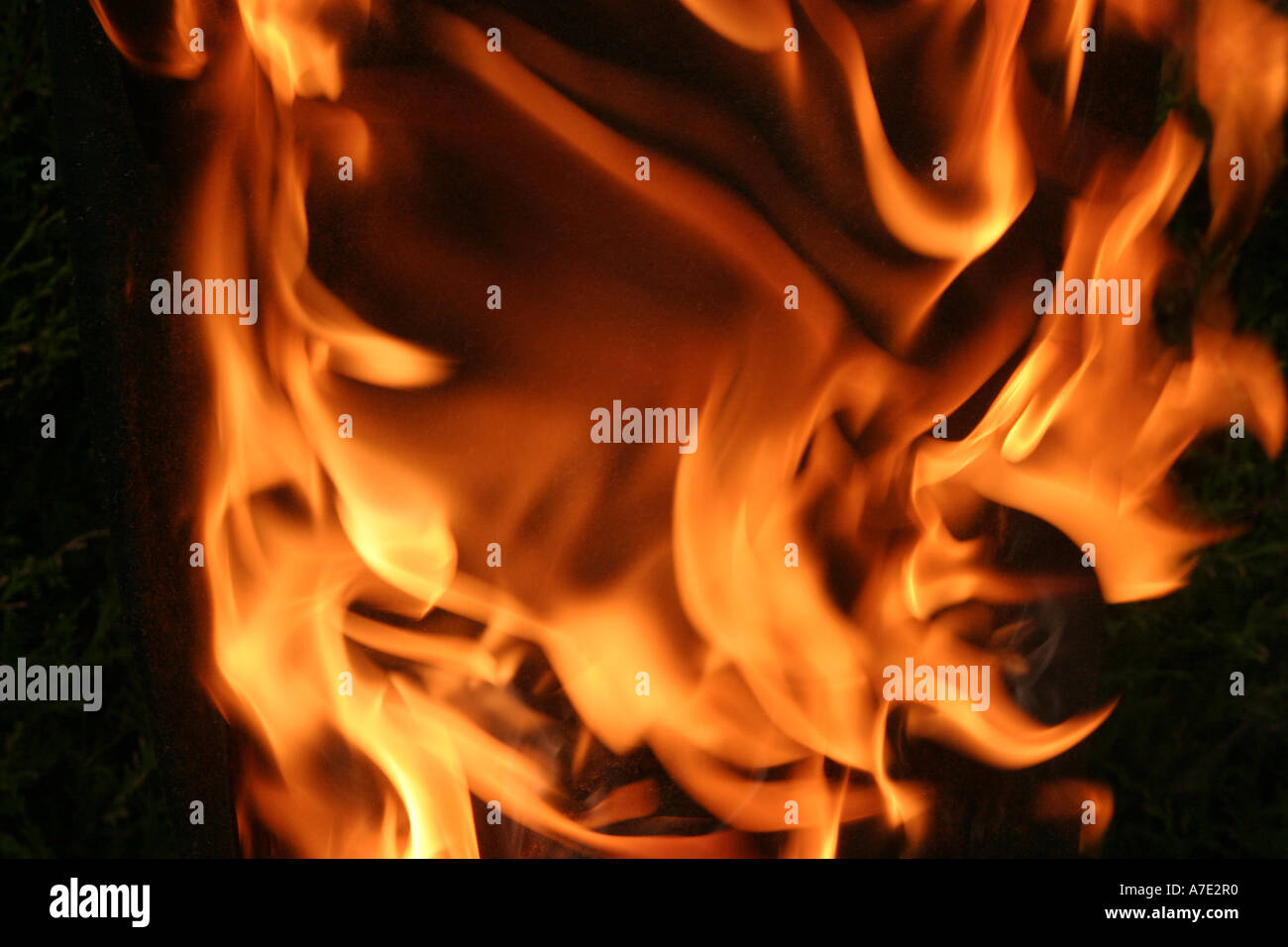 Orange Flames against a black background Stock Photo
