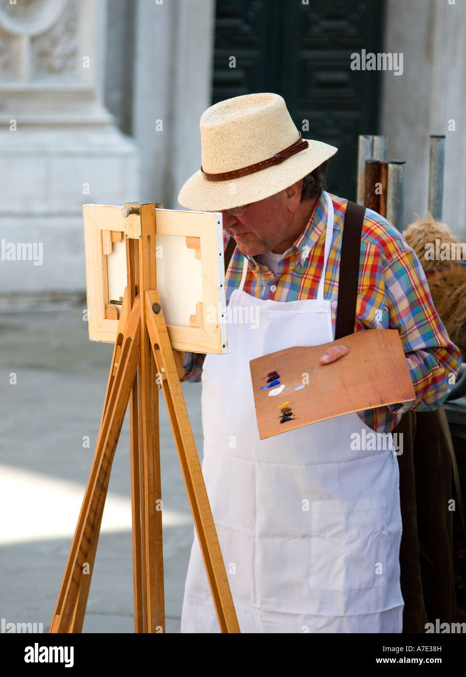 An artist painting on the streets of Venice, Stock Photo