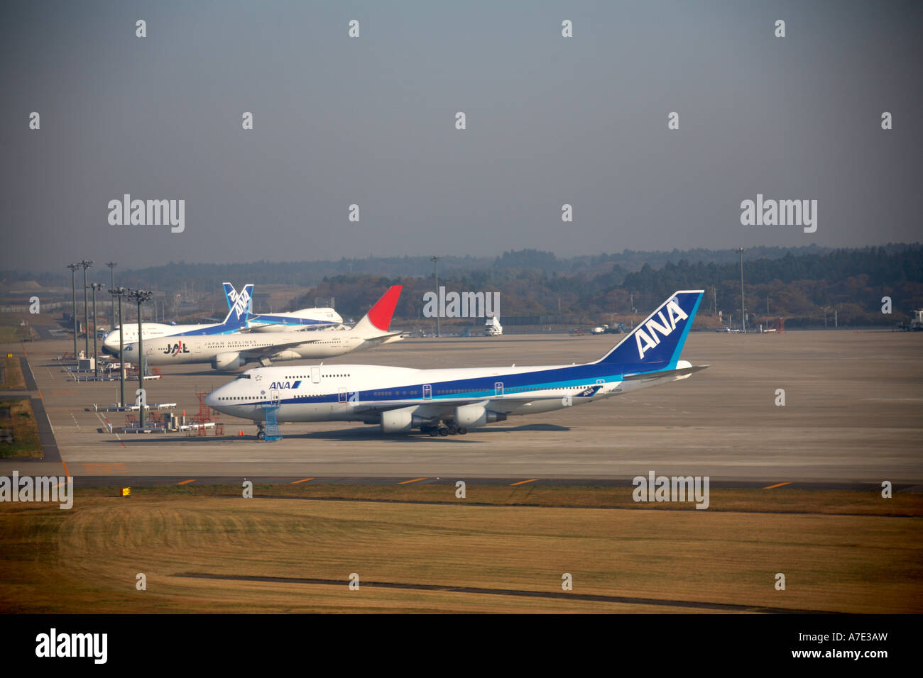 High level oblique aerial view of Narita Airport with ANA and JAL aircraft and runways Tokyo Japan Asia Stock Photo