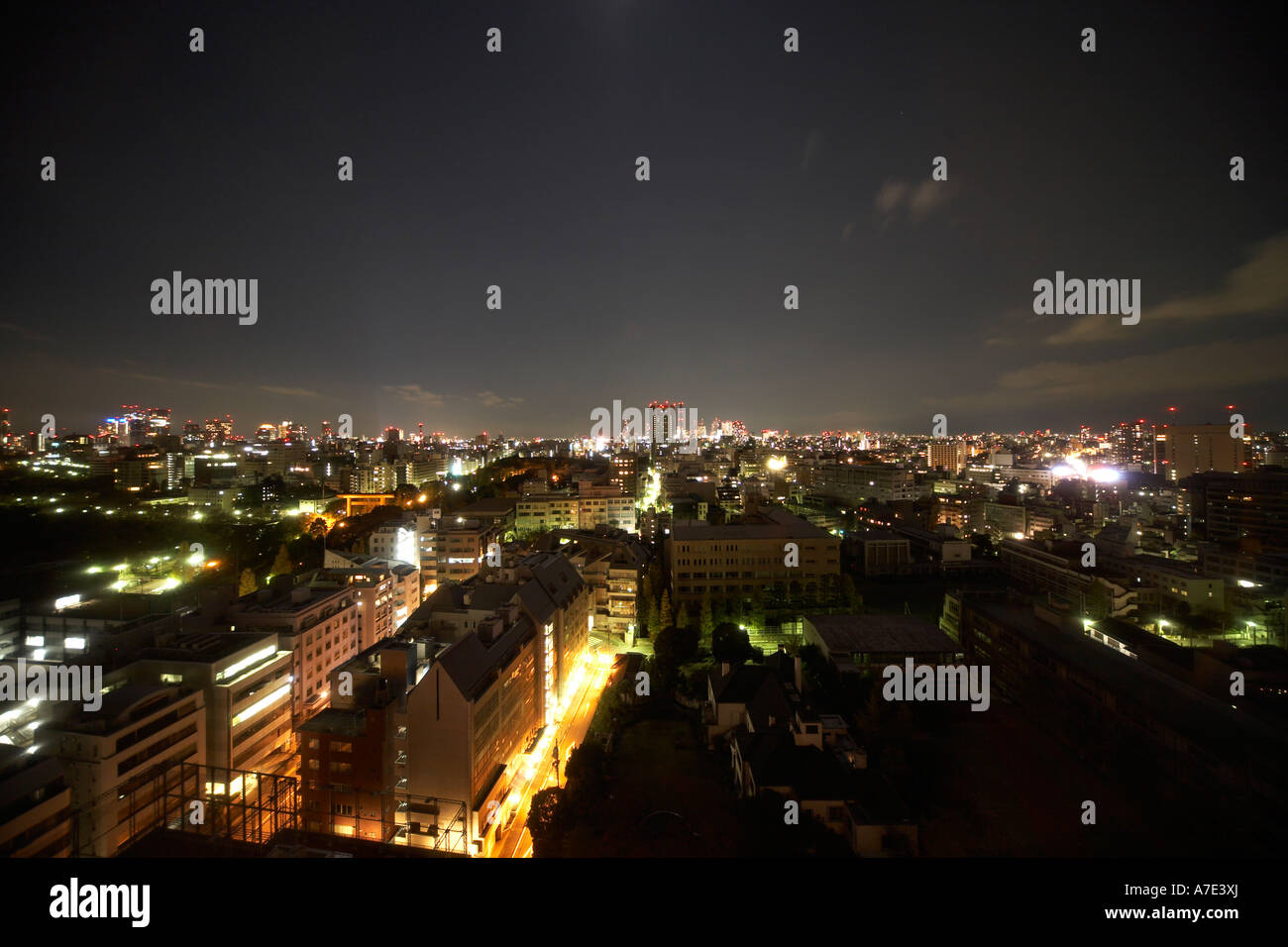 High level oblique semi aerial twilight  night view north east of office buildings and roads from Hotel Grand Palace city Tokyo Stock Photo
