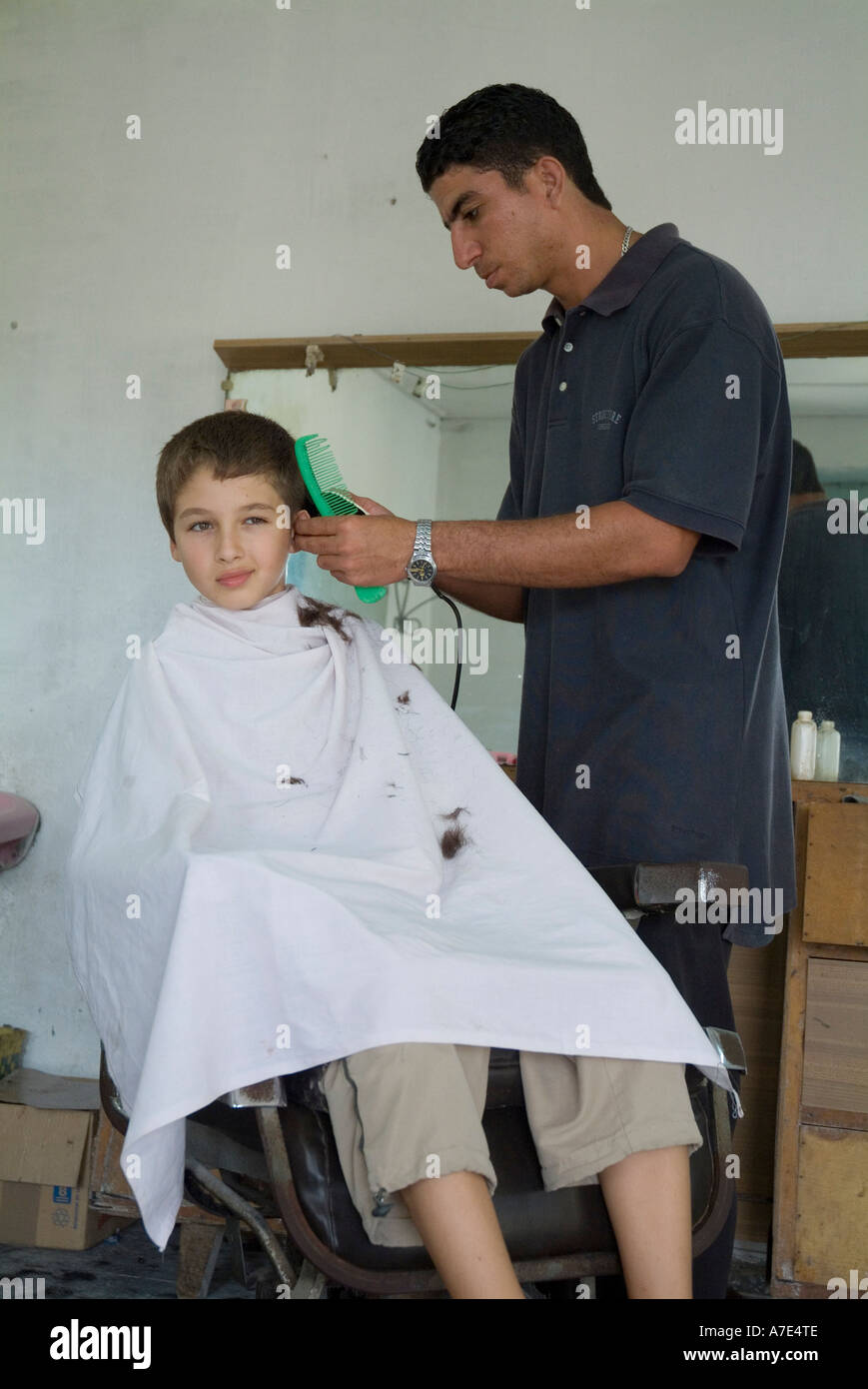 Boy receiving a haircut at a barbershop in Vinales, Pinar del Rio Province, Cuba. Stock Photo