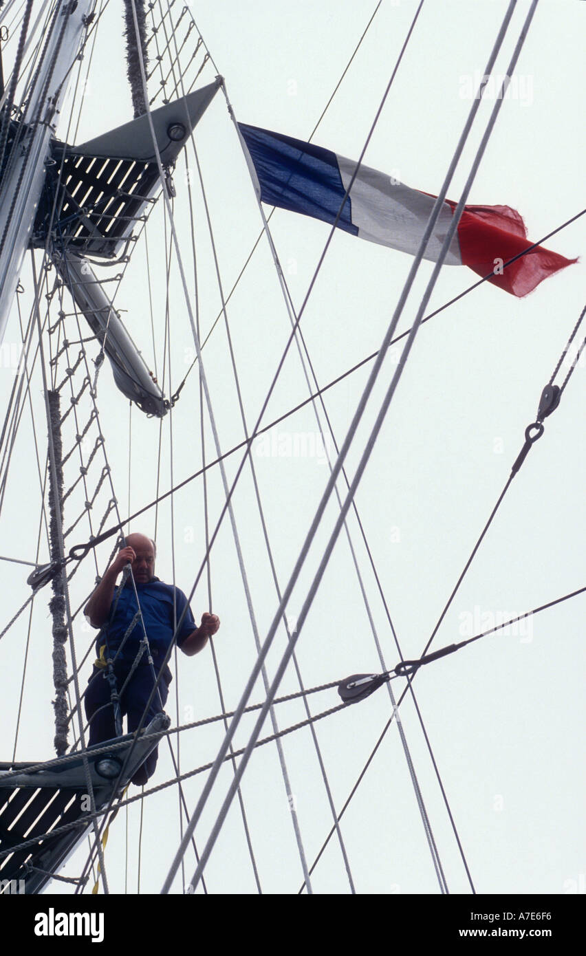 Raising the French Tricolour as courtesy flag aboard the British tall