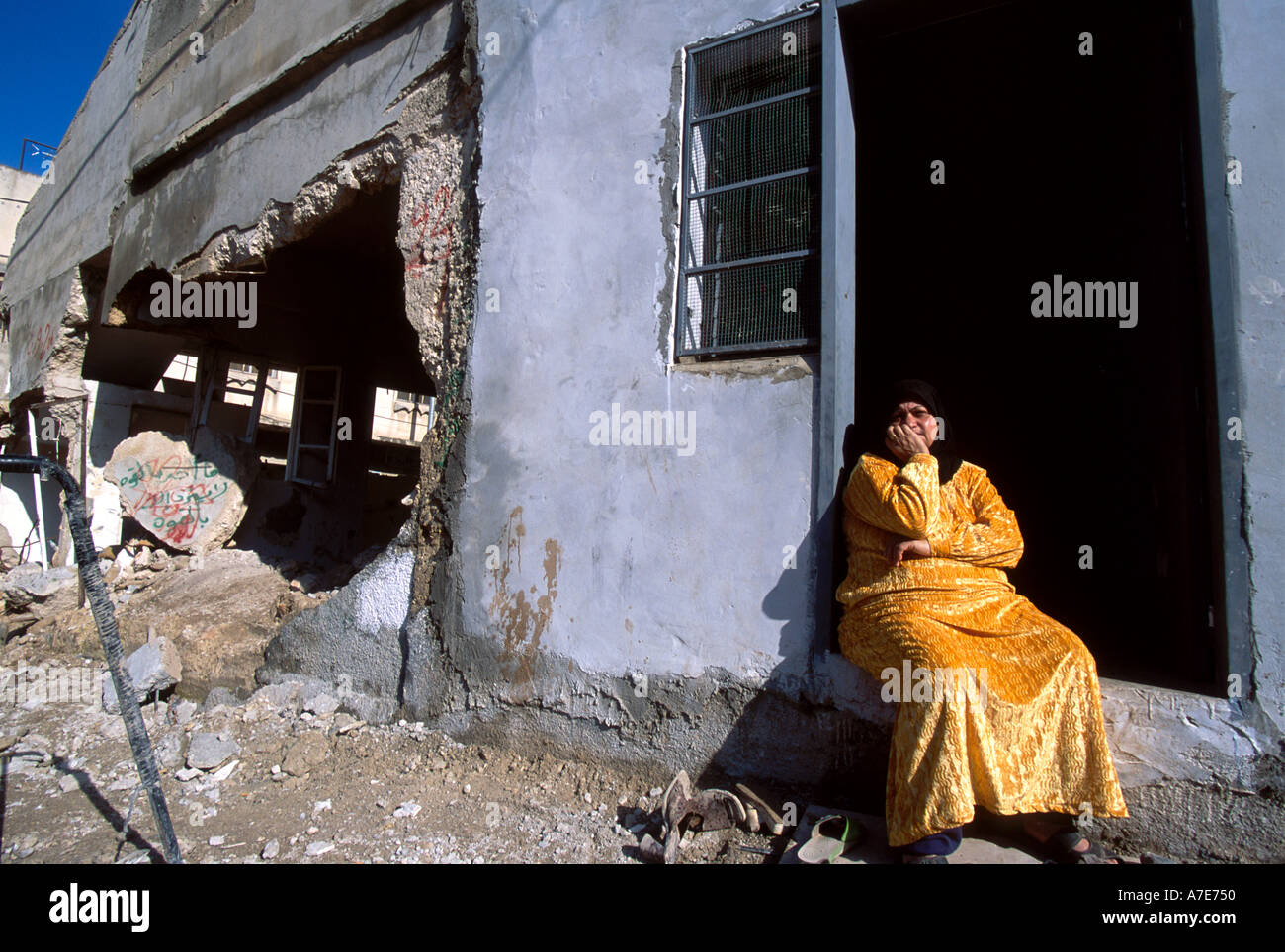 Palestinian woman sitting in her house doorstep, Muhaiem camp Jenin ...