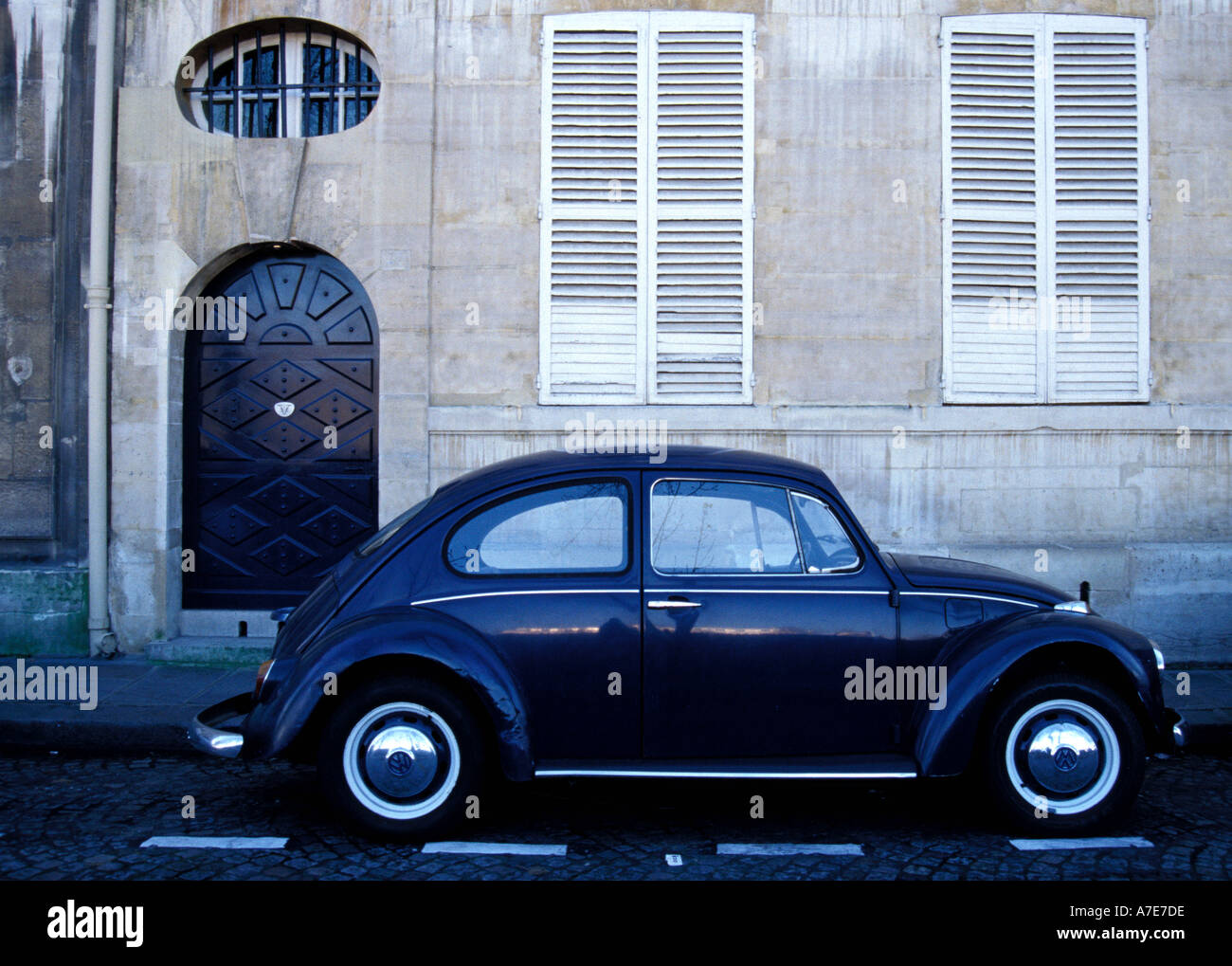 Blue Vintage Volkswagen Beetle parked on Quai de Bourbon Ile St Louis Paris Stock Photo