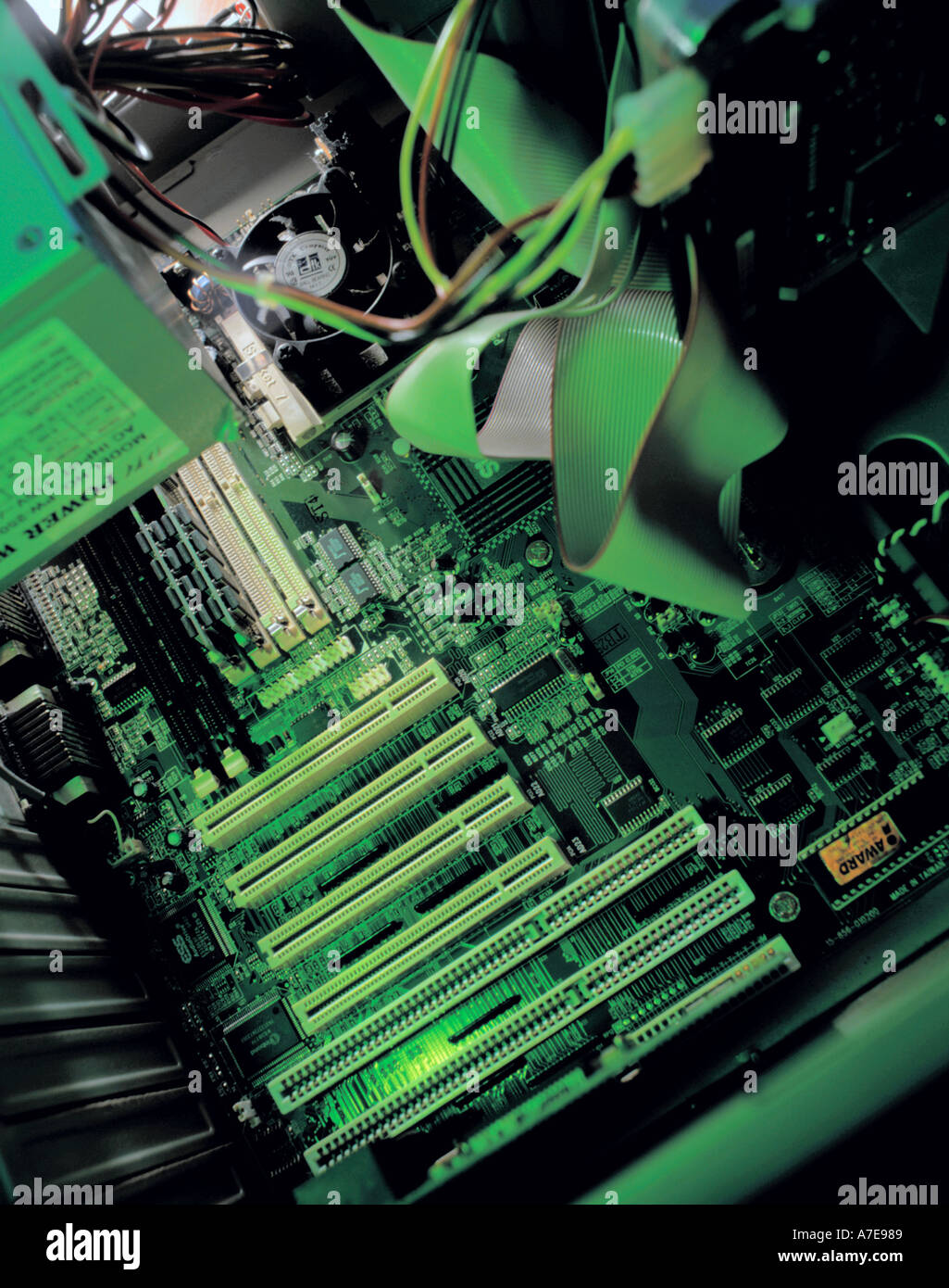 Inside a personal computer, showing mother board with SCSI connections for outlet ports at the base of the picture Stock Photo