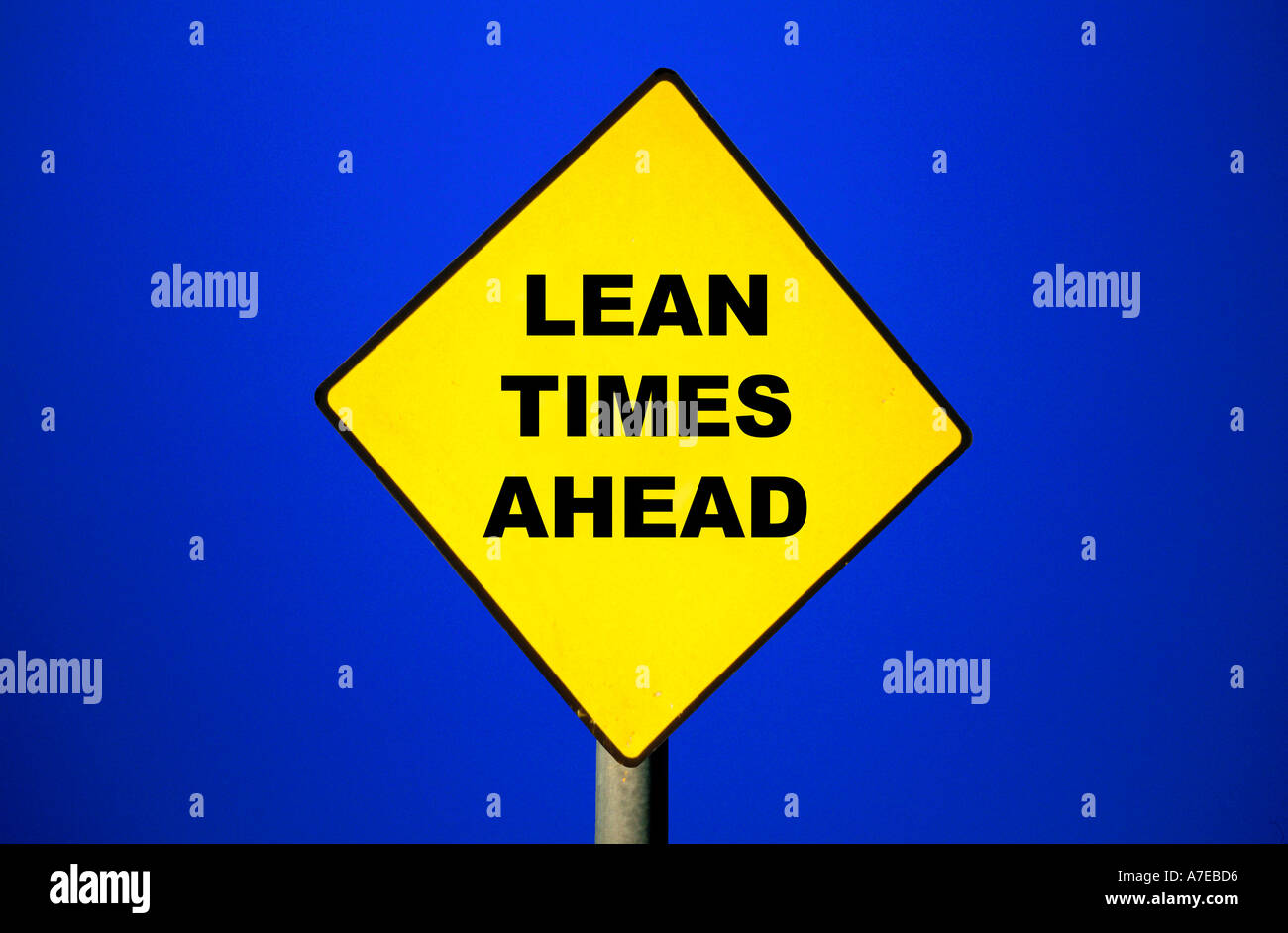 Road Sign with Lean Times Ahead written on it Metaphor for financial problems ahead Stock Photo