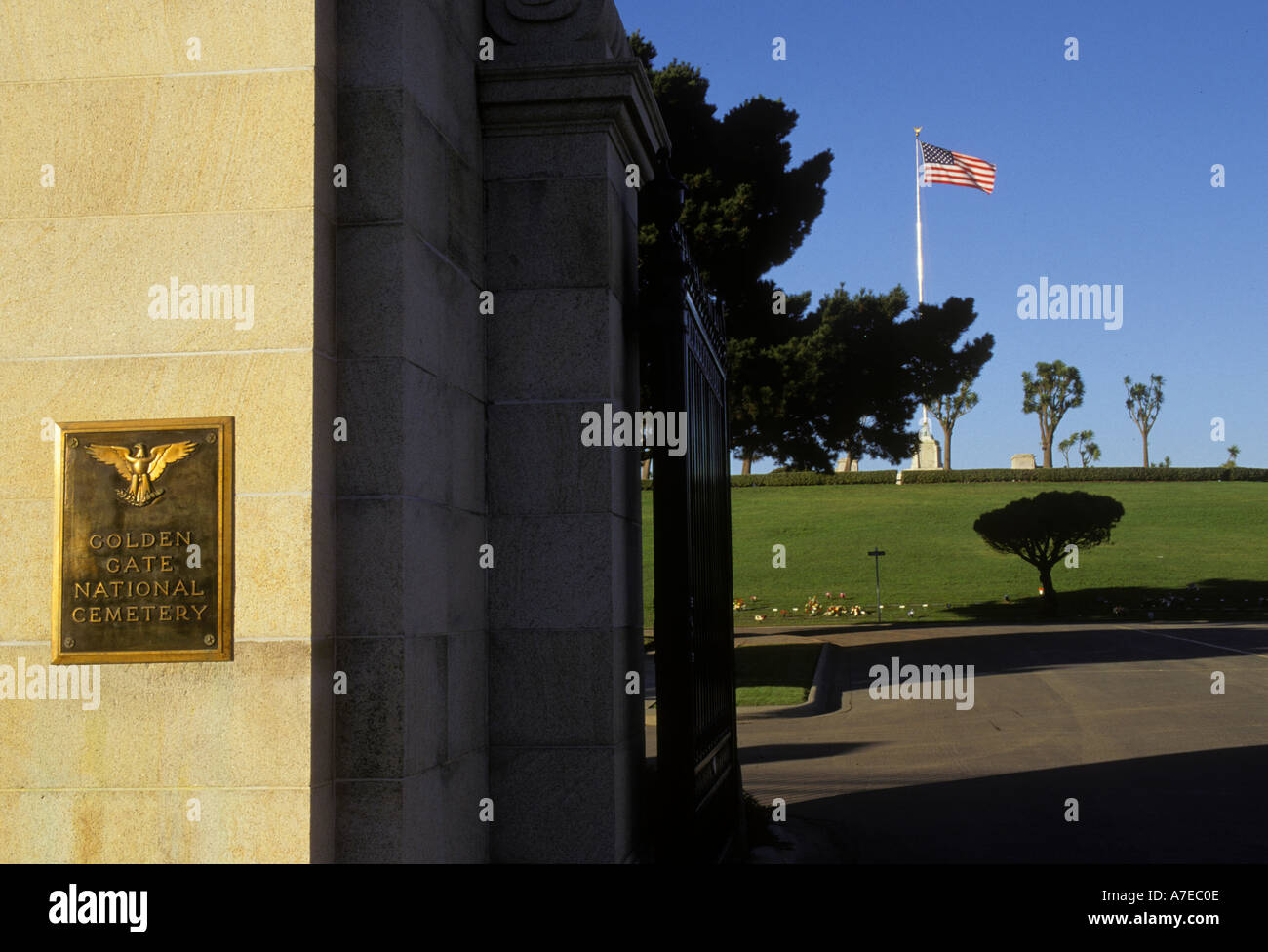 California San Bruno Golden Gate National Cemetery entrance gate United States flag on pole Stock Photo