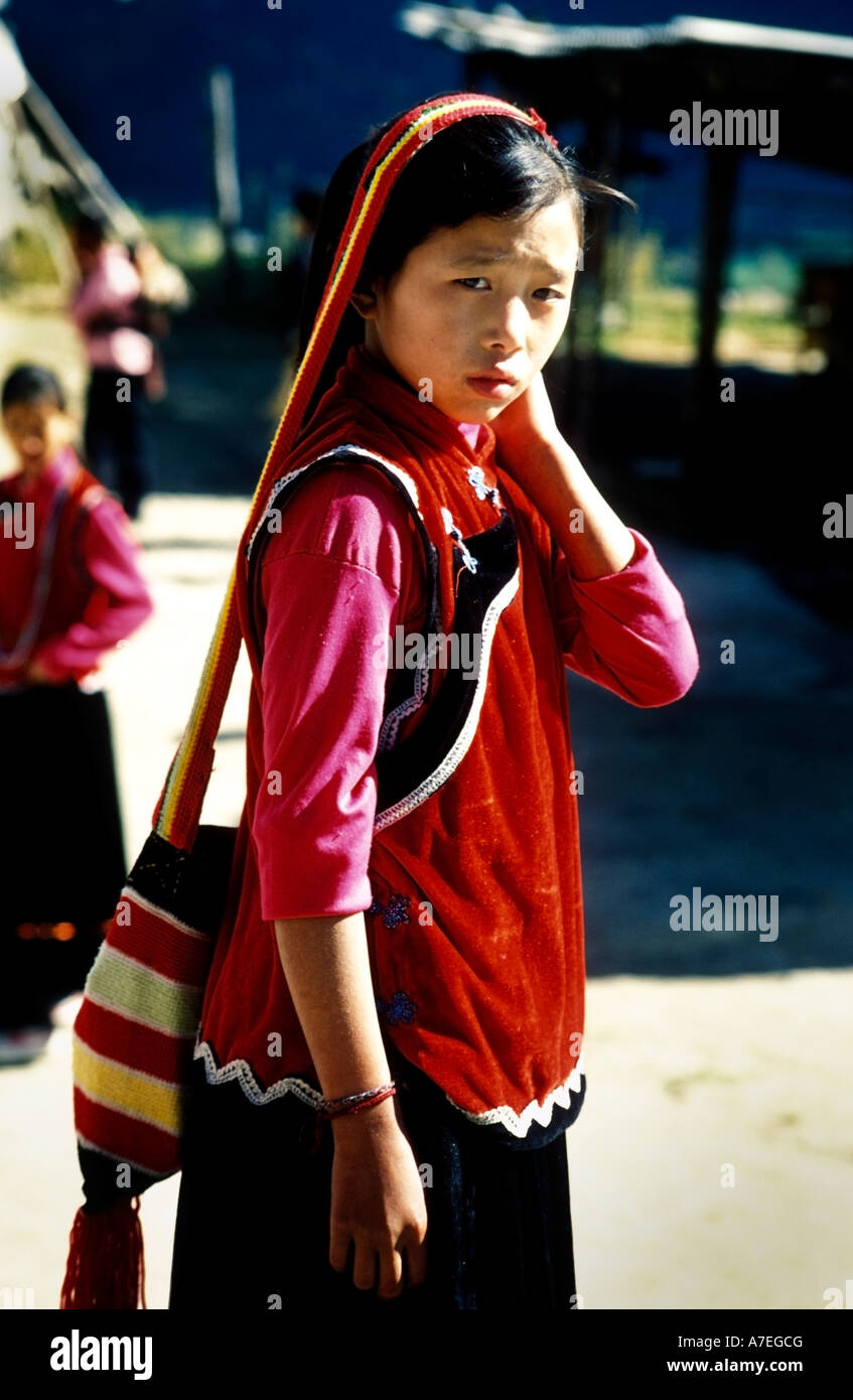 Young traditionally dressed Lisu woman carrying a bag Stock Photo - Alamy