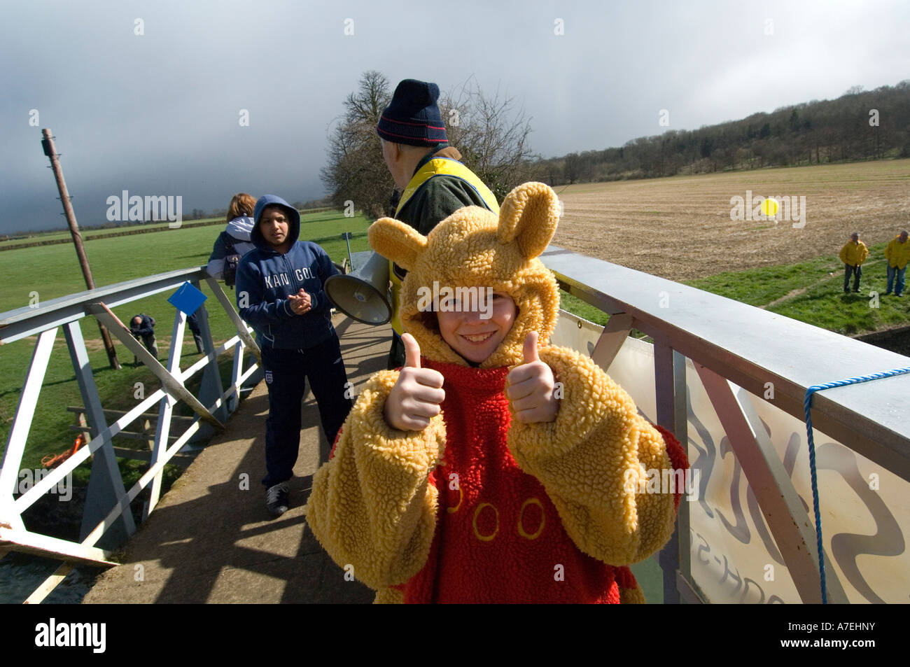 Competitor on the bridge at World Pooh Sticks championships,Wittenham