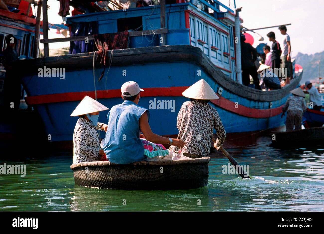 Locals use a floating basket (Thung Chai) made from bamboo to get to a  fishing trawler at Nhatrang in Vietnam Stock Photo - Alamy