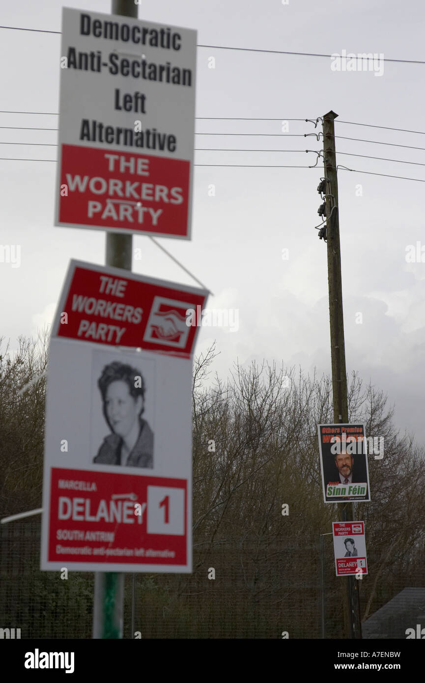 vertical election posters for the workers party and sinn fein put on poles for northern ireland assembly elections 2007 Stock Photo