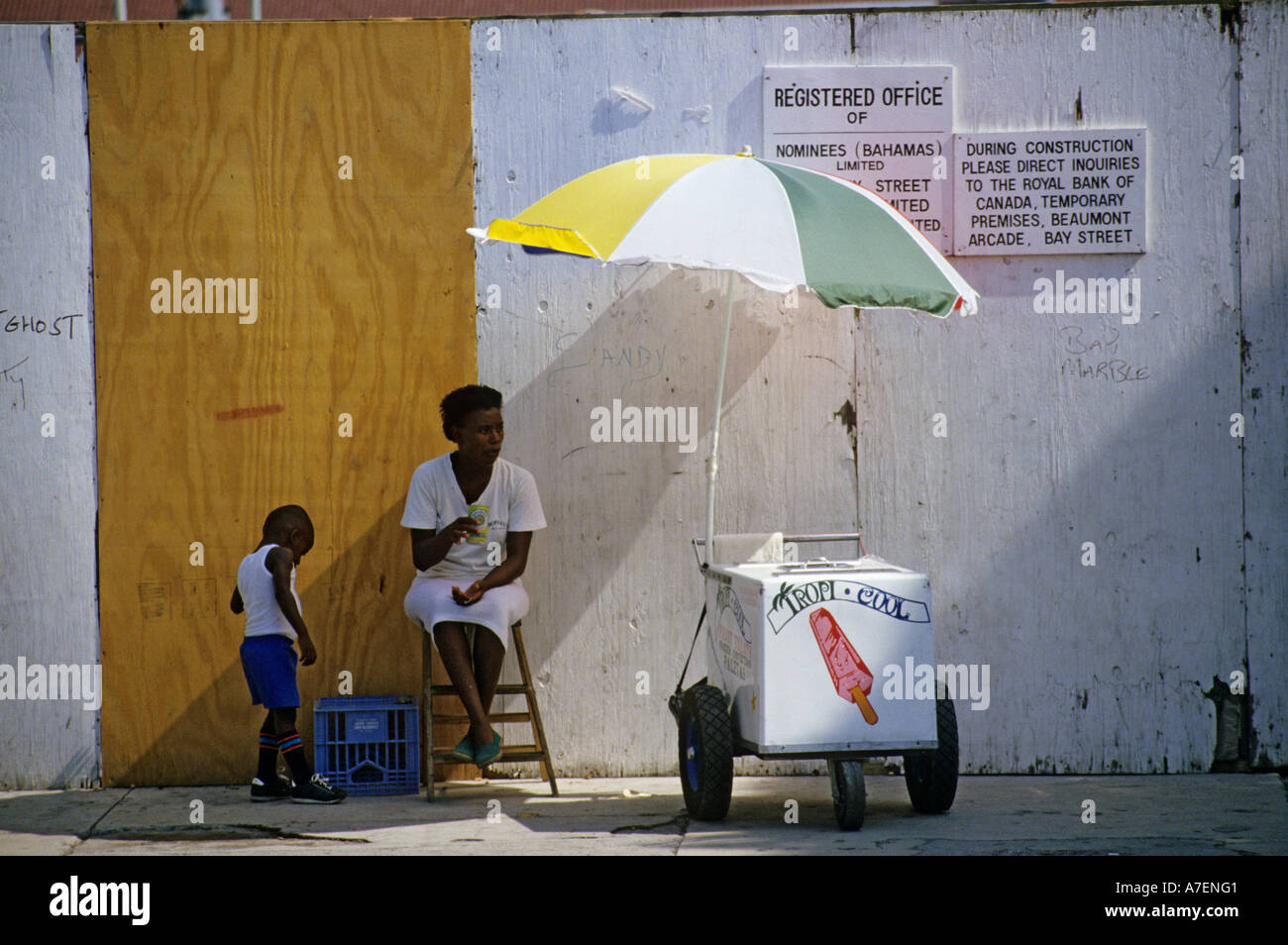 Black woman selling ice cream from a trolley in the street Nassau New Providence island Bahamas Stock Photo