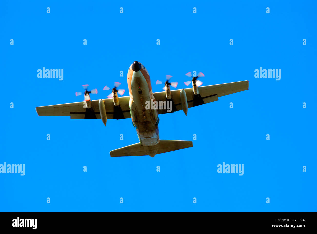 White propellor plane on blue sky background coming in to land Stock Photo