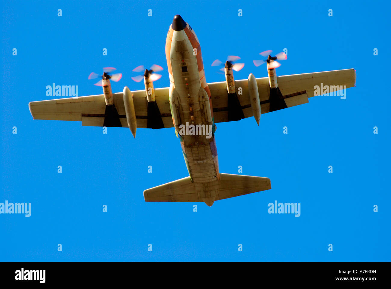 White propellor plane on blue sky background coming in to land Stock Photo