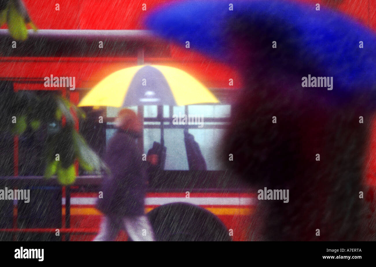 Londoners make their way through a rainstorm. Stock Photo