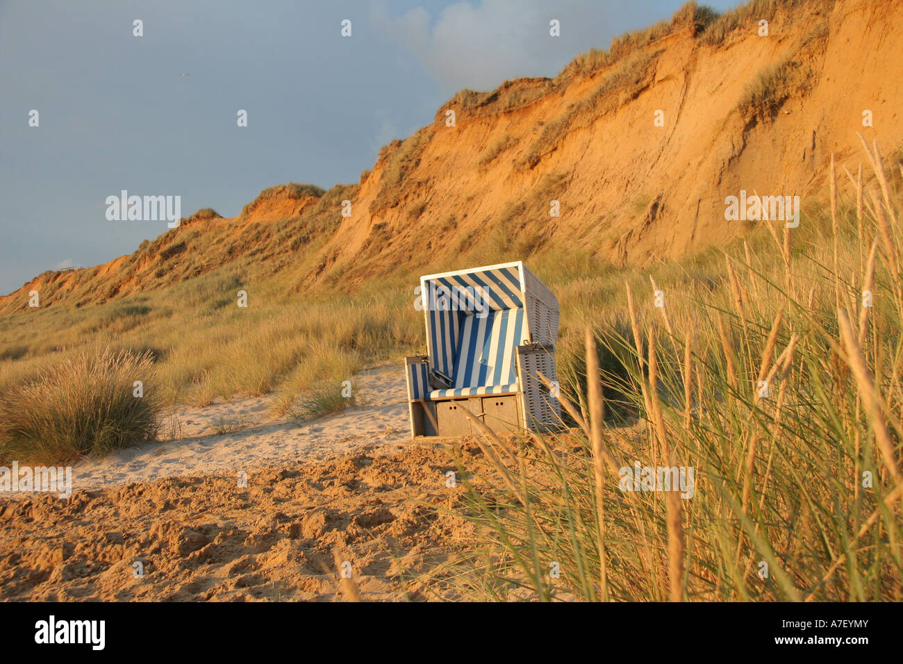 Beach chair in front of the red cliff, Kampen, Wenningstedt, Sylt, Schleswig-Holstein, Germany Stock Photo