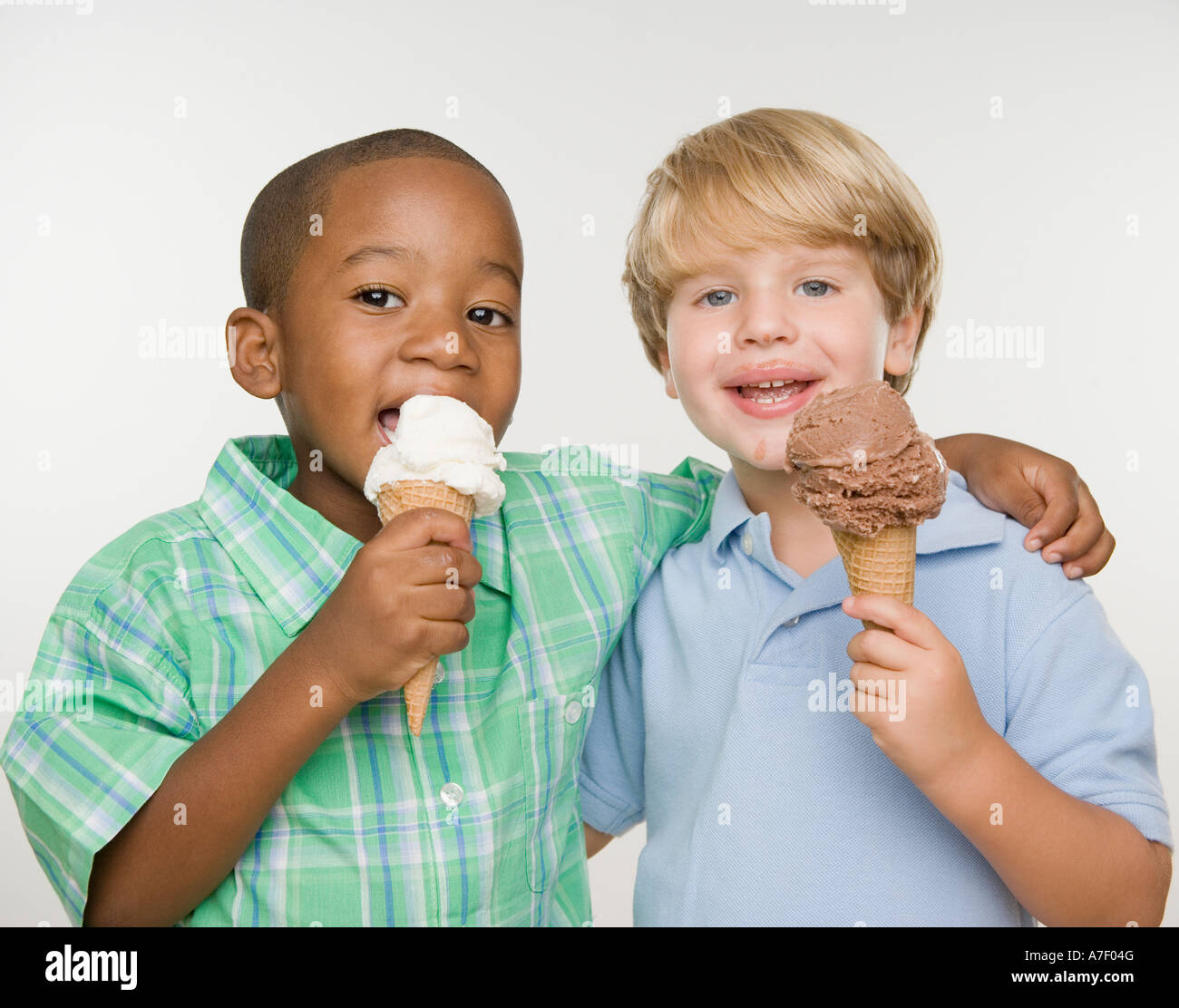 Two young boys eating ice cream cones Stock Photo Alamy