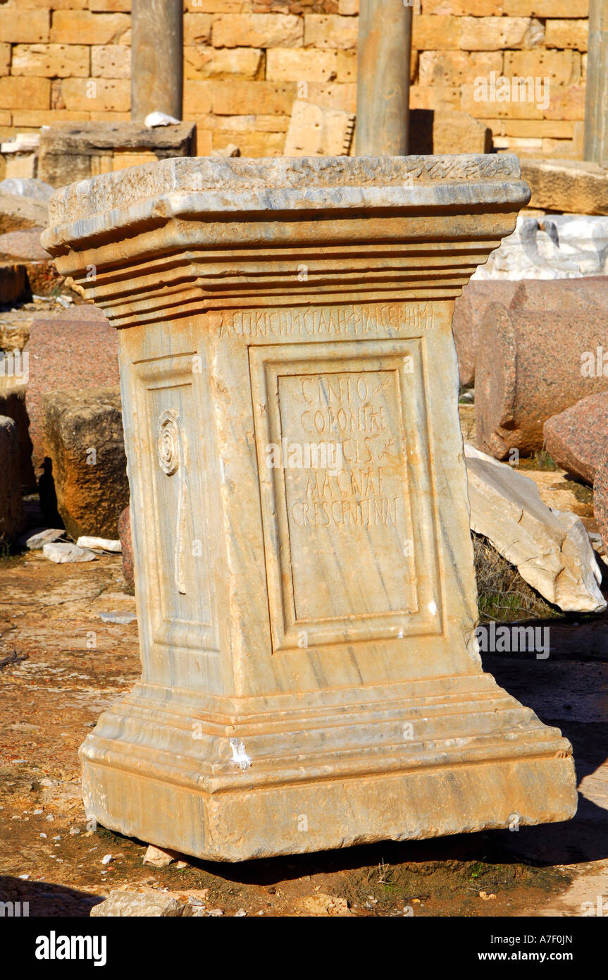 Ancient Roman Pedestal, inscription Genio Coloniae Lepcis Magnae Crescentinae, Leptis Magna, Libya Stock Photo