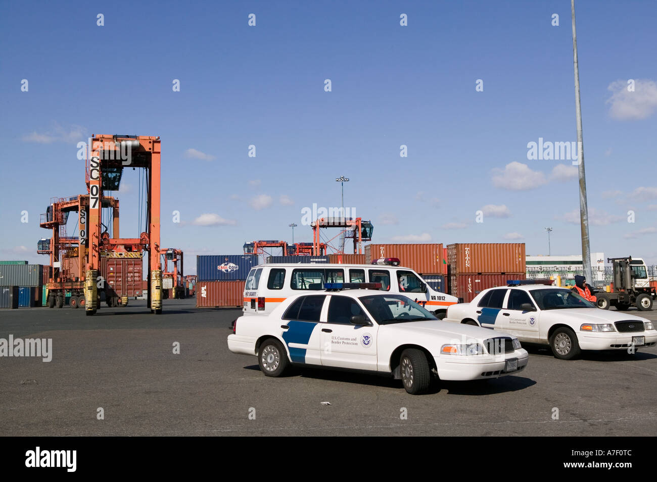 Police Container Terminal Security vehicles stand in the Port of Newark Container Terminal in ...