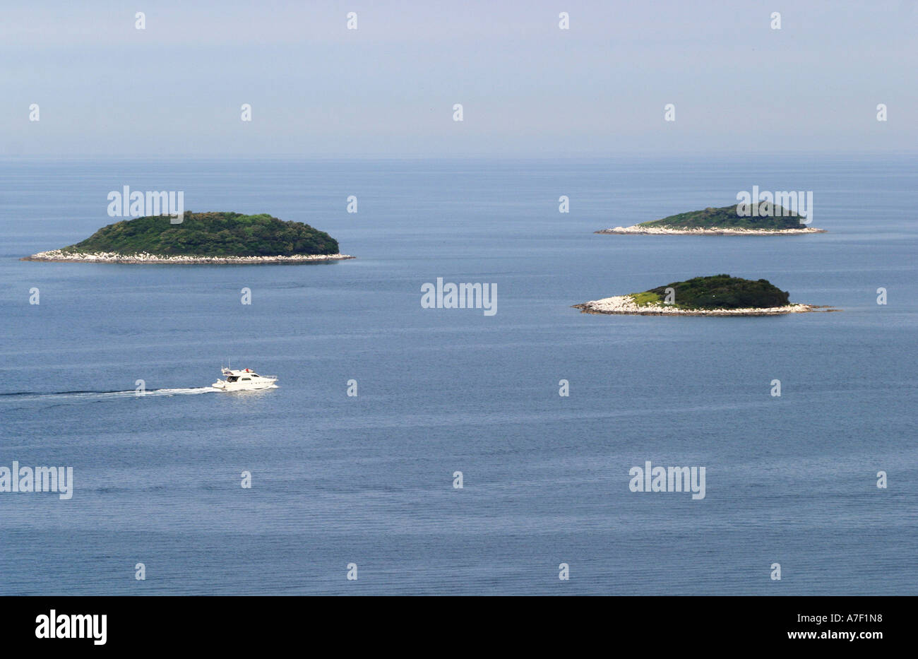 Boat near uninhabited islands on the Croatian coast near Vrsar Stock Photo