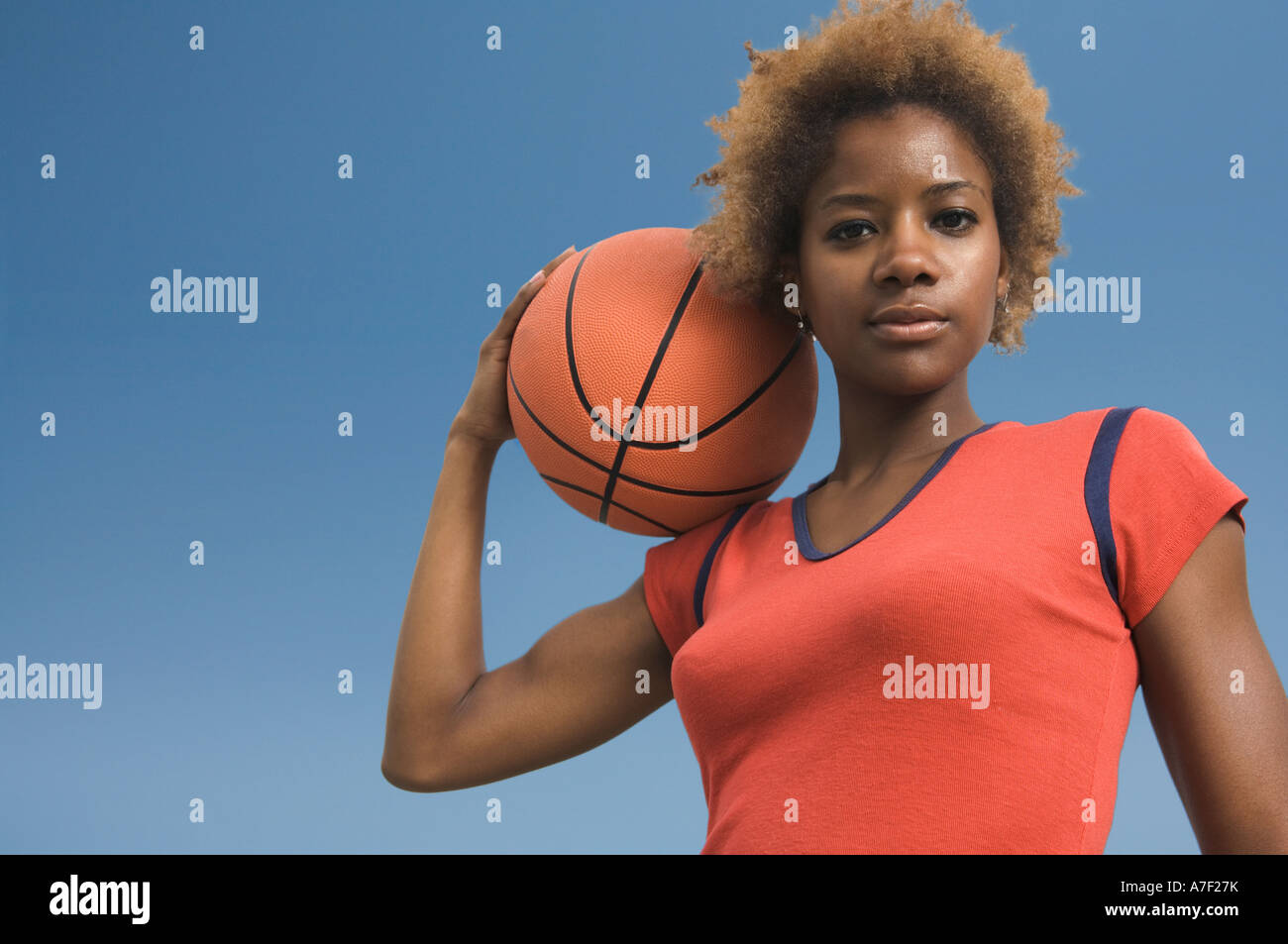 African woman holding basketball Stock Photo - Alamy