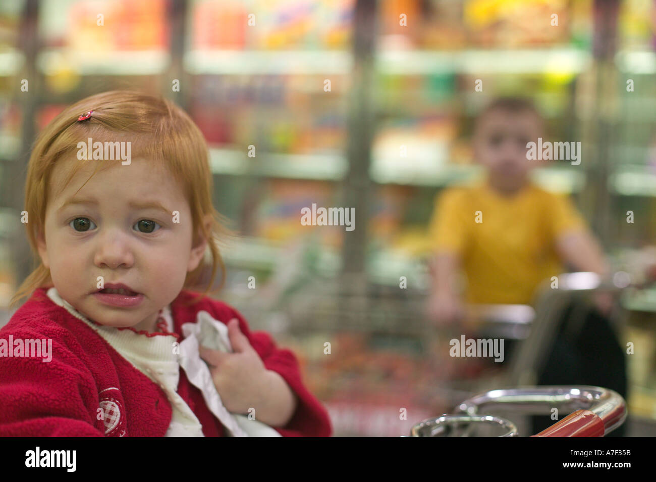 Boy in grocery store sitting hires stock photography and images Alamy