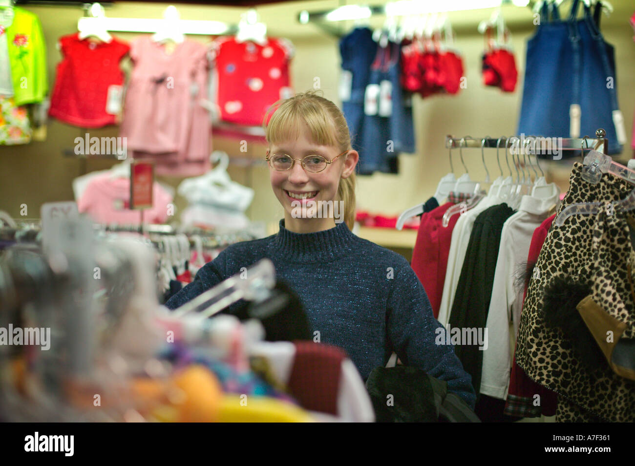 Twelve Year Old Girl Shopping For New Clothes In Department Store Stock Photo