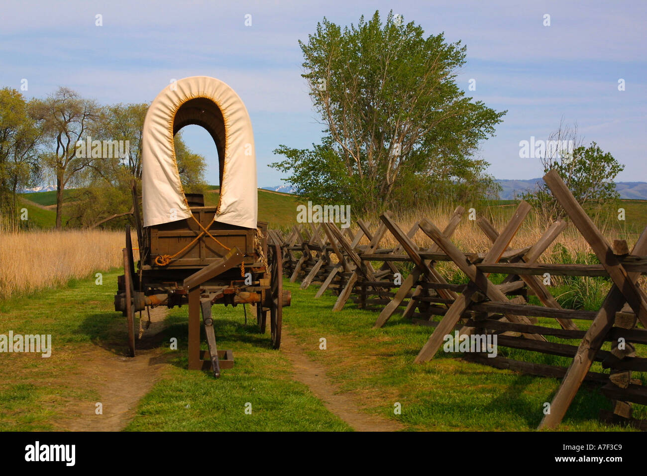 Oregon Trail ruts and Conastoga wagon Whitman Mission US National Park Historic Site Walla Walla Washington Stock Photo