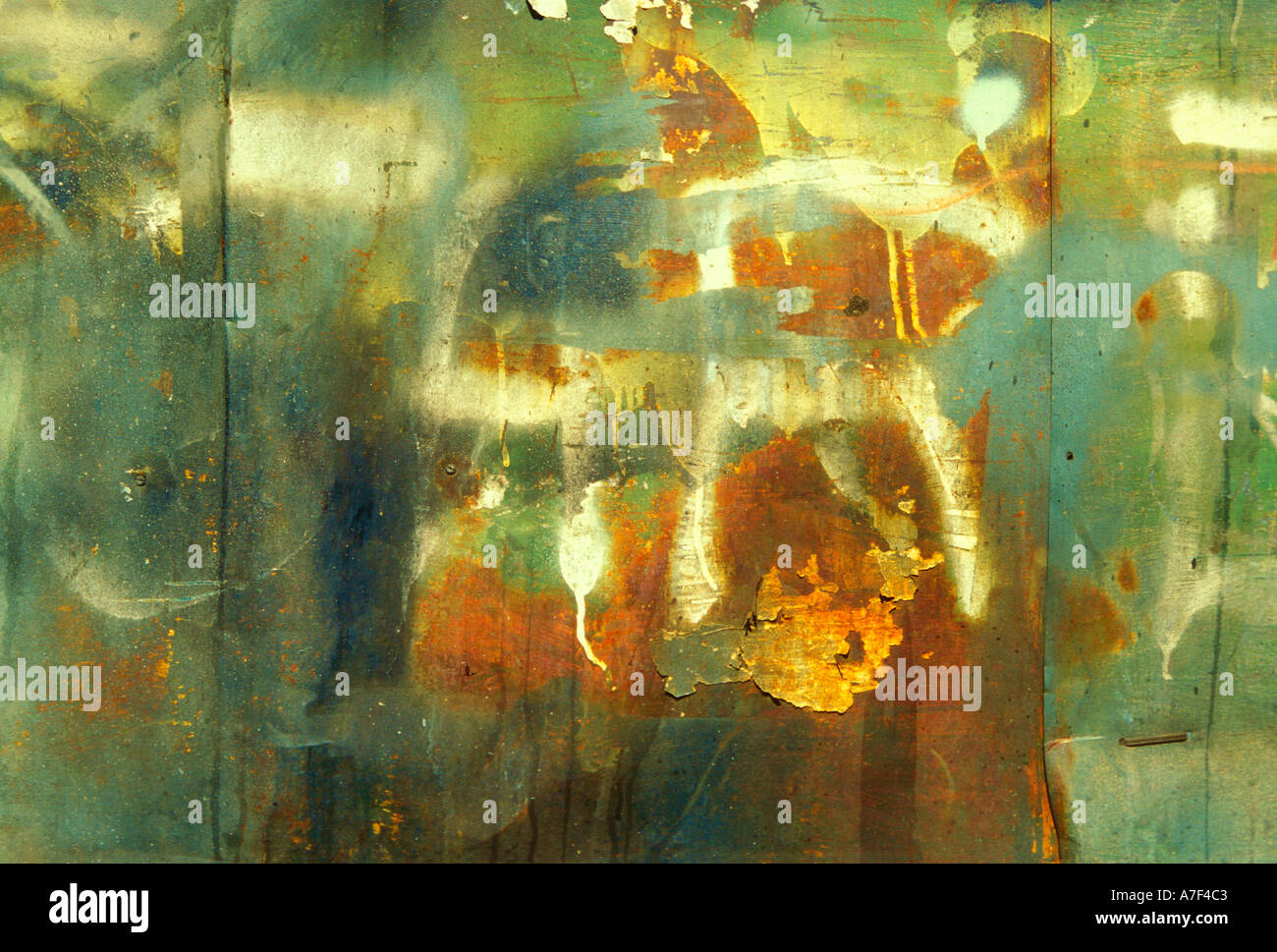 An aged and weathered industrial metal surface with rust and large ...