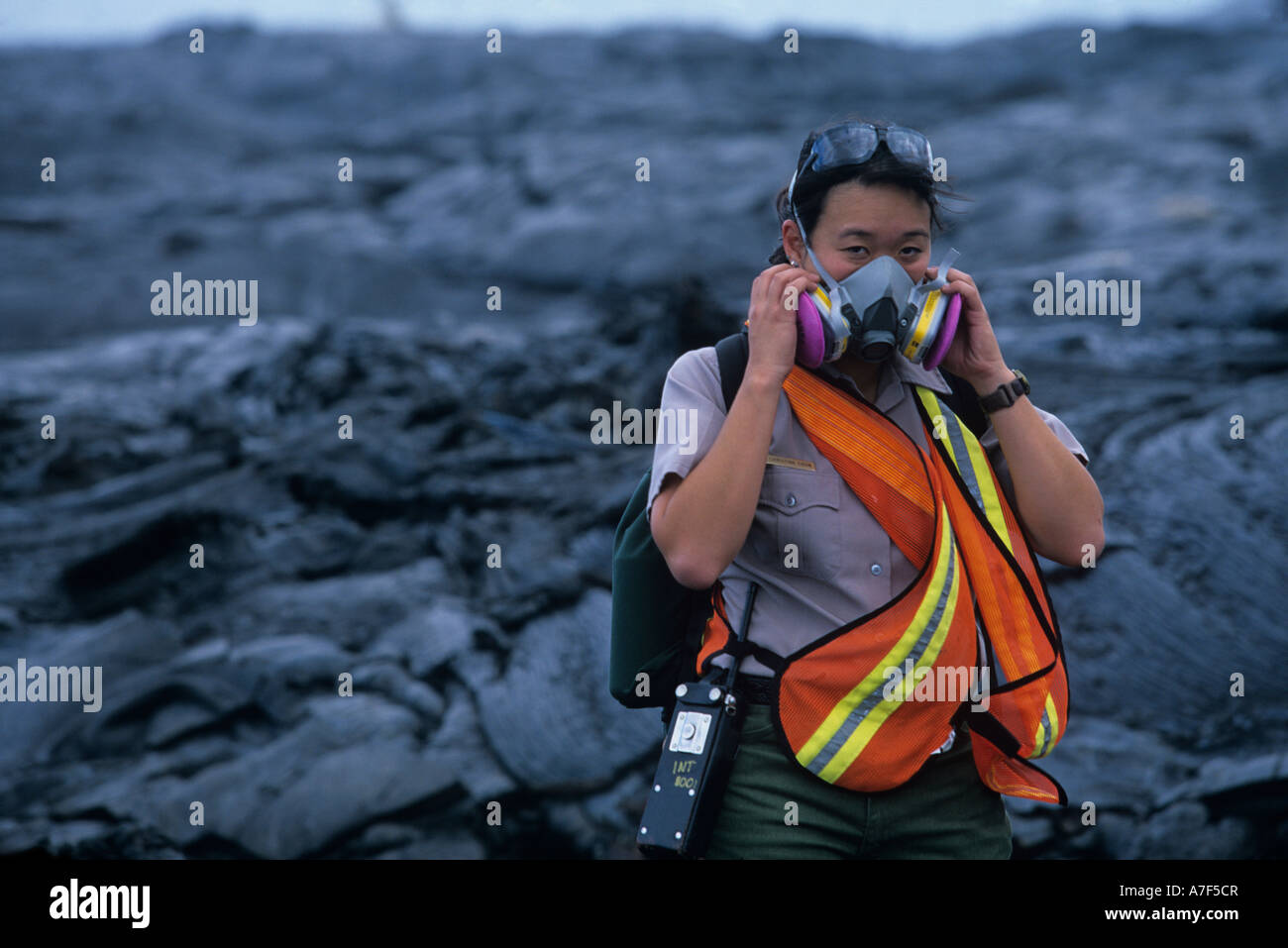 USA Hawaii Volcanoes National Park Female park ranger wears respirator