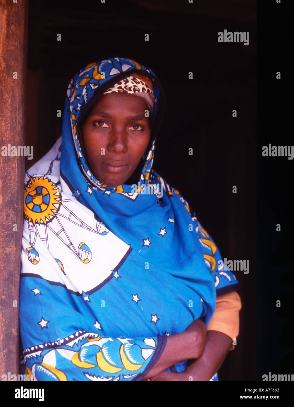 Zanzibar A village lady wearing a khanga the traditional coloured wrap Stock Photo