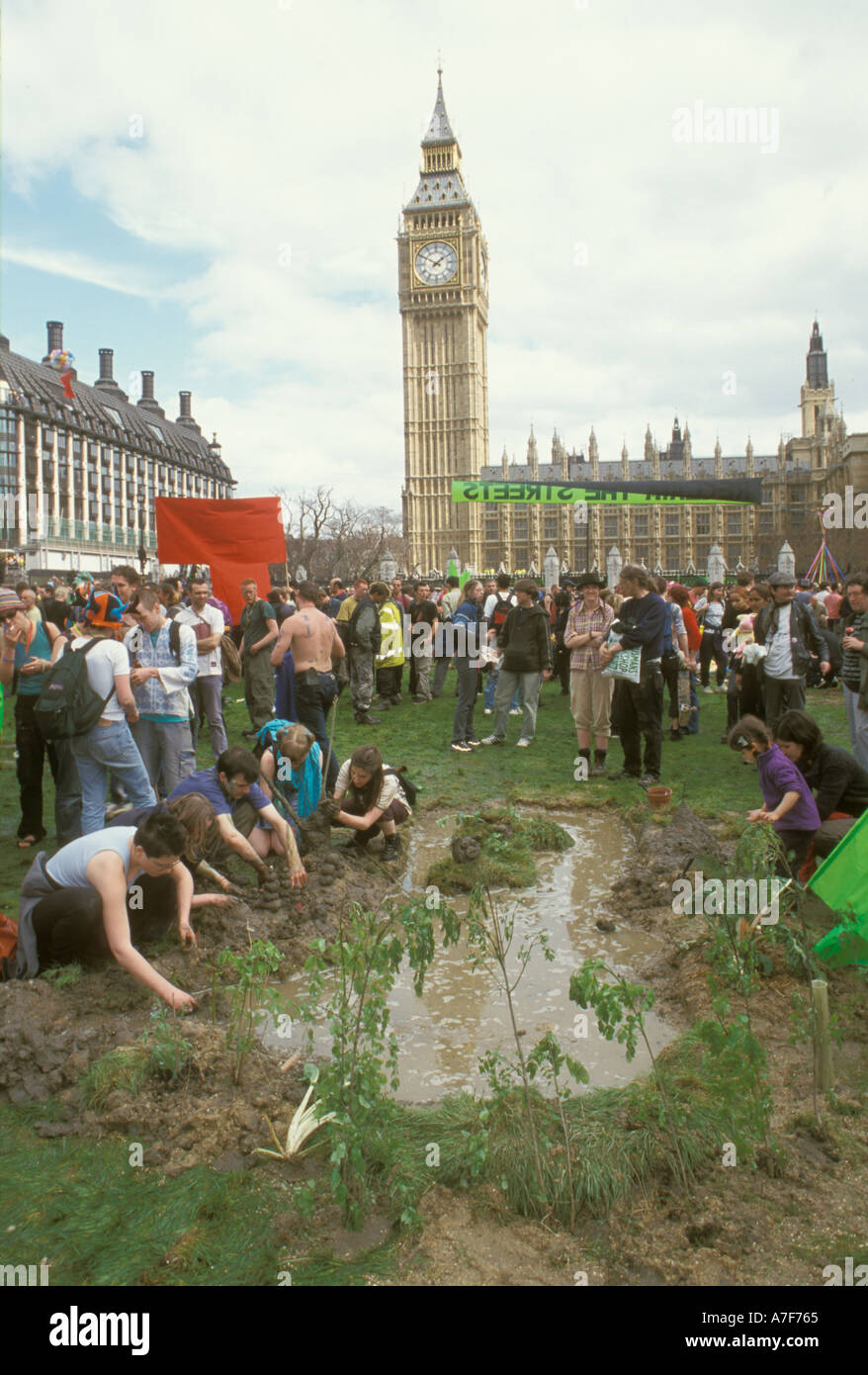 Guerrilla gardeners create a pond at Mayday anti globalisation protest Parliment Square London UK Stock Photo