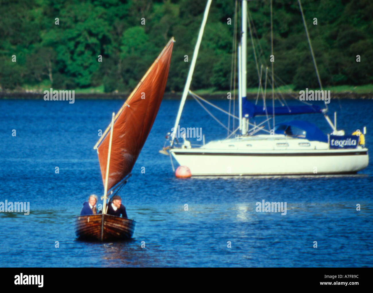 Traditional day sailing boat being sailed on Loch Craignish Clinker Lapstreak hull tan sails with lugsail rig Stock Photo