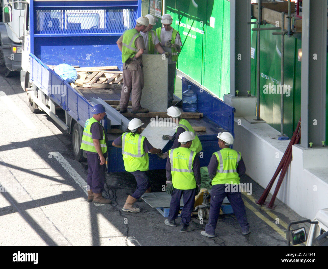 Unloading building material off delivery lorry building site City of ...