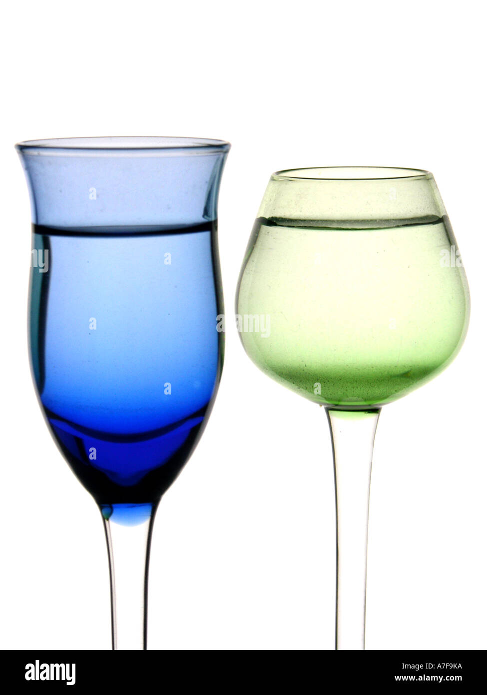 Cordial glasses filled with liquid on white background Stock Photo Alamy