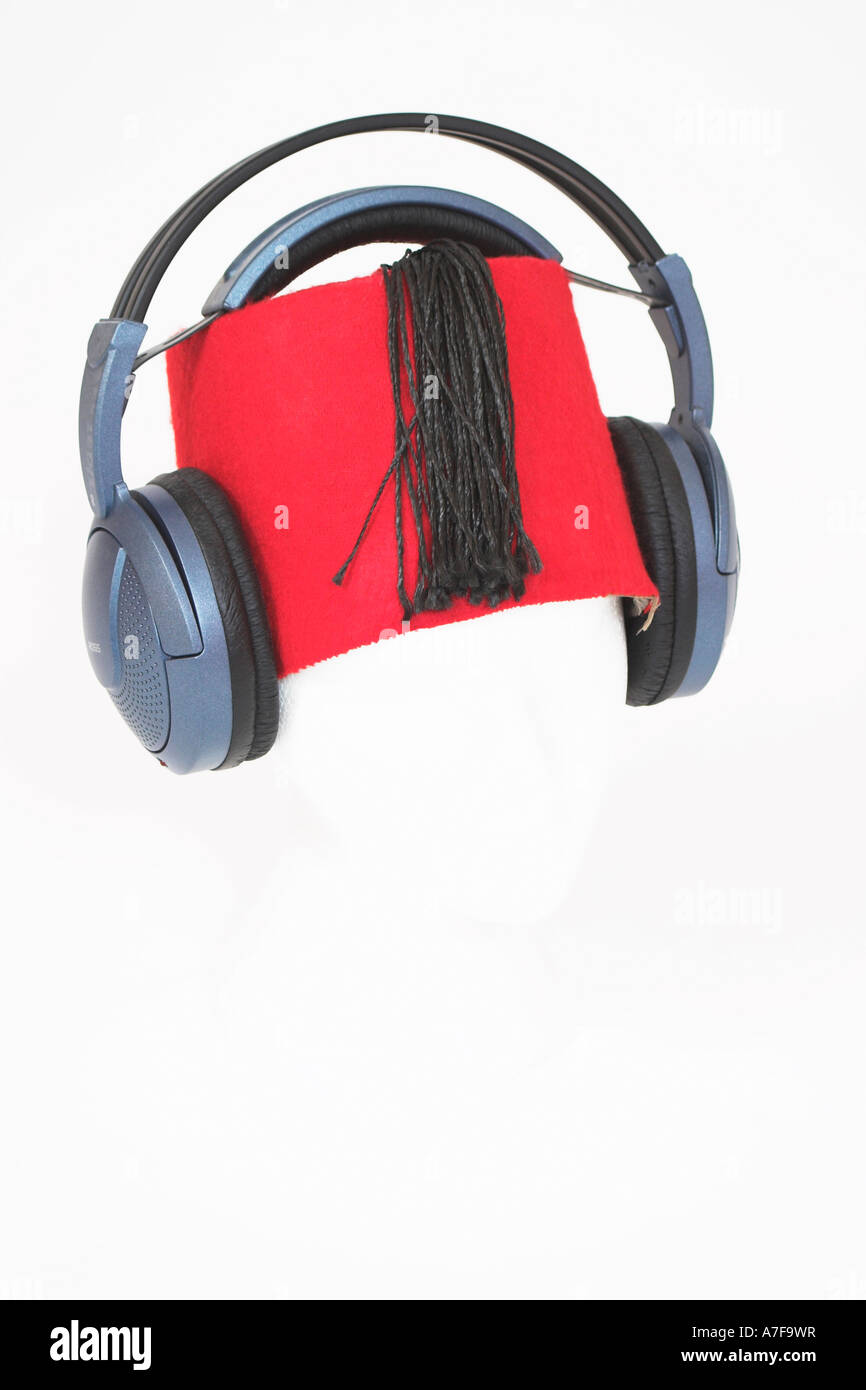 Egyptian Music - Headphones and Fez on a white polystyrene head. Stock Photo