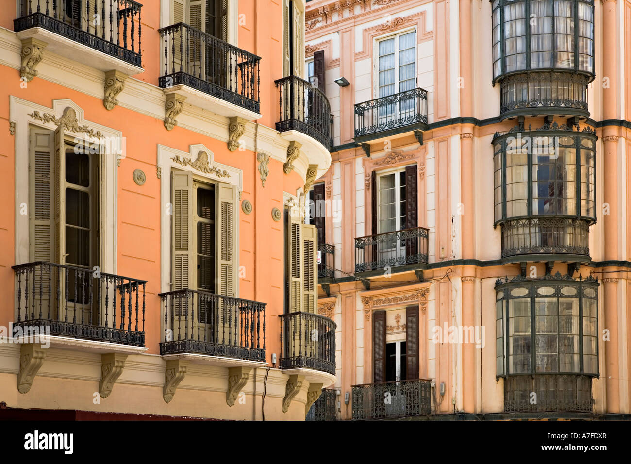 Traditional balconies and shuttered windows Malaga city Spain Stock Photo