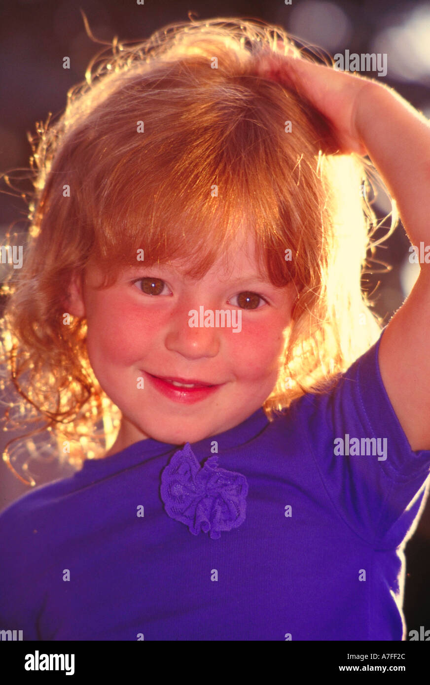 Portrait of young red haired girl with rosy cheeks Stock Photo