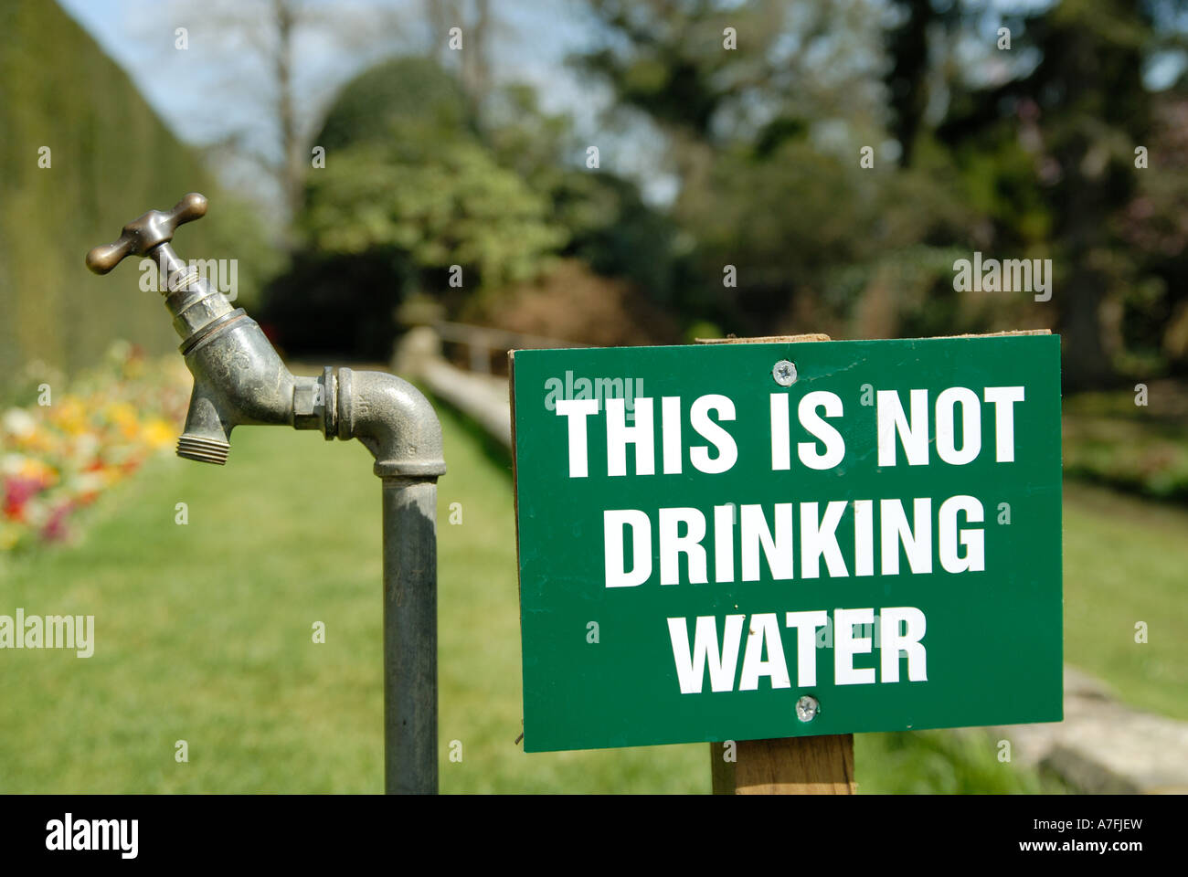 A garden taps and sign Stock Photo Alamy