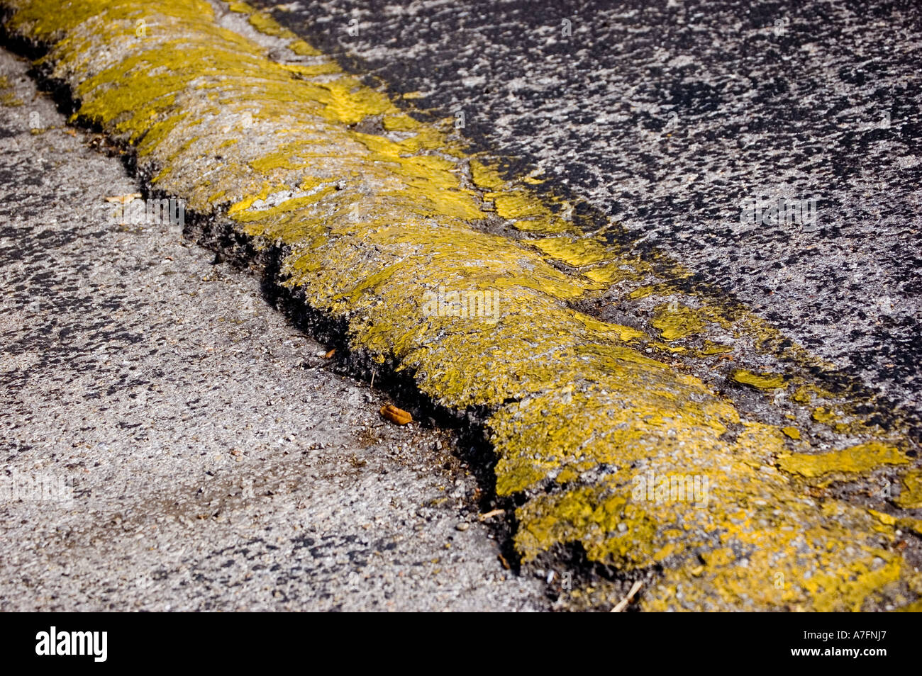 Yellow cement speed bump on street Stock Photo Alamy