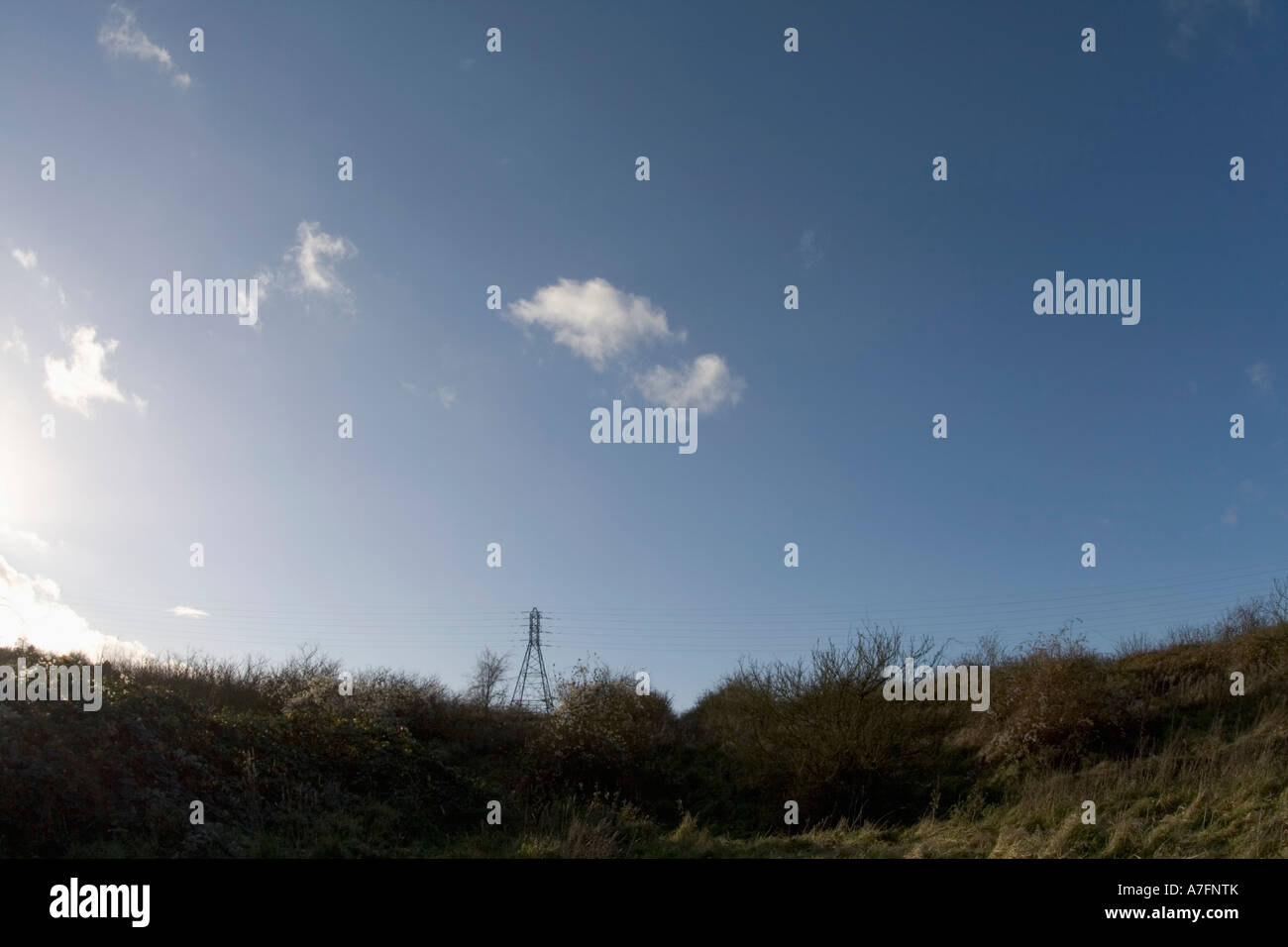 pylon in countryside blue sky Stock Photo - Alamy
