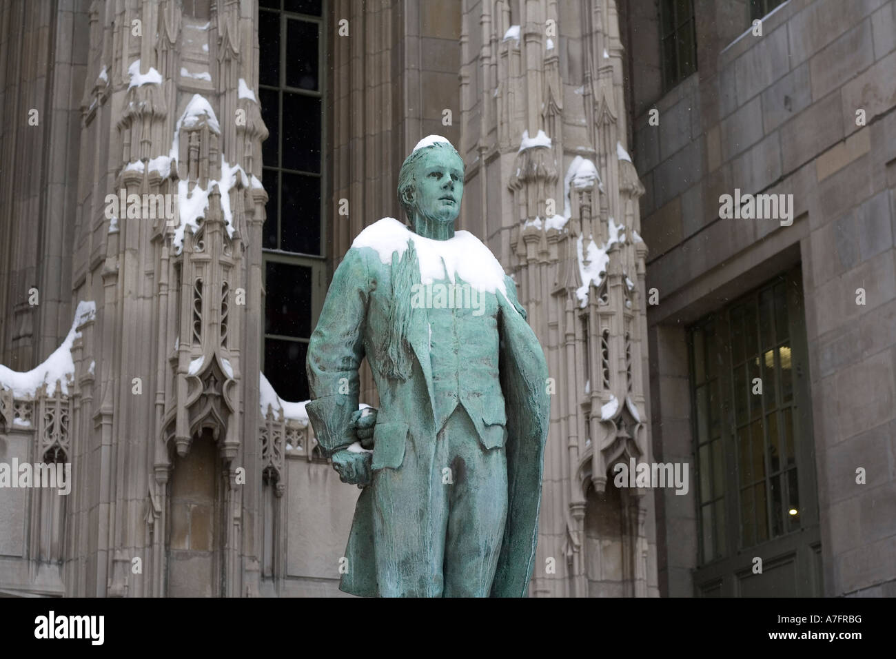 statue of Nathan Hale in front of Chicago Tribune Tower in snow Stock