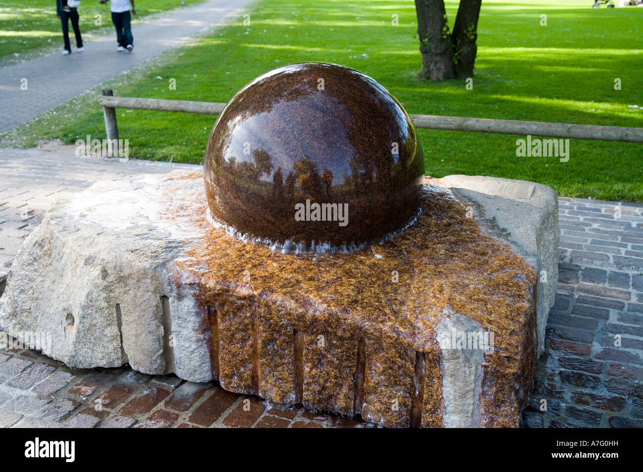 Phanomena Brunnen is a fountain in which a two foot diameter stone ball is suspended on a thin film of water allowing the ball t Stock Photo