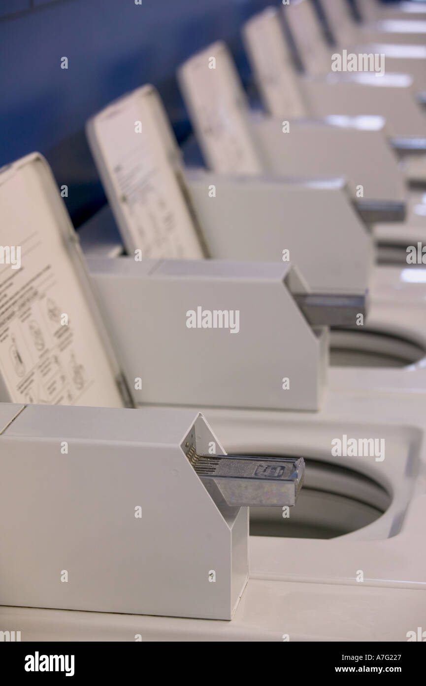 Laundry machine quarters hires stock photography and images Alamy