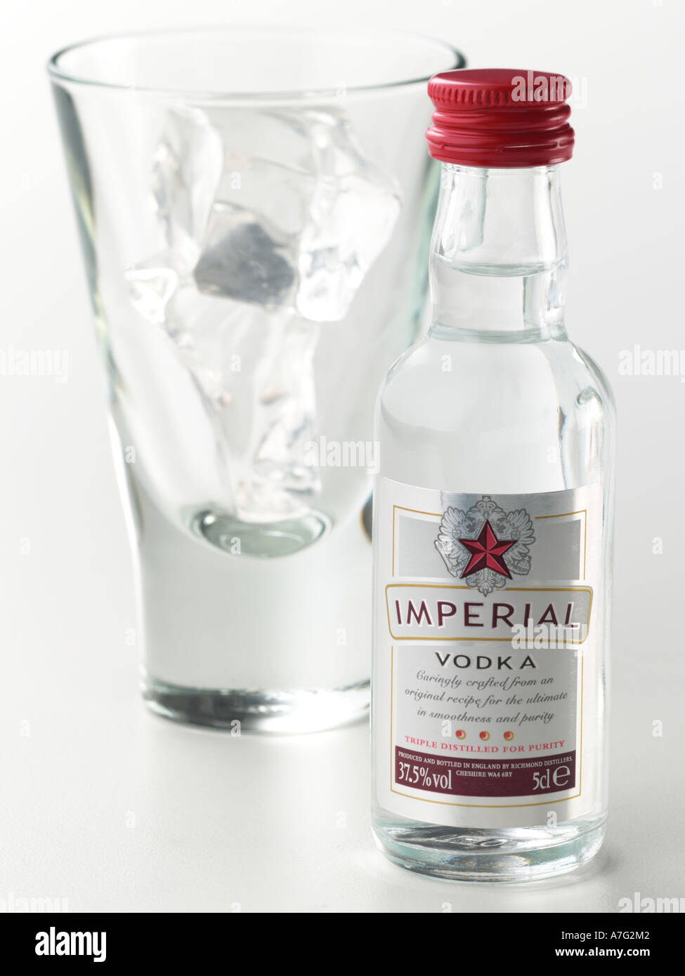 Miniature Vodka bottle and glass with ice Stock Photo - Alamy