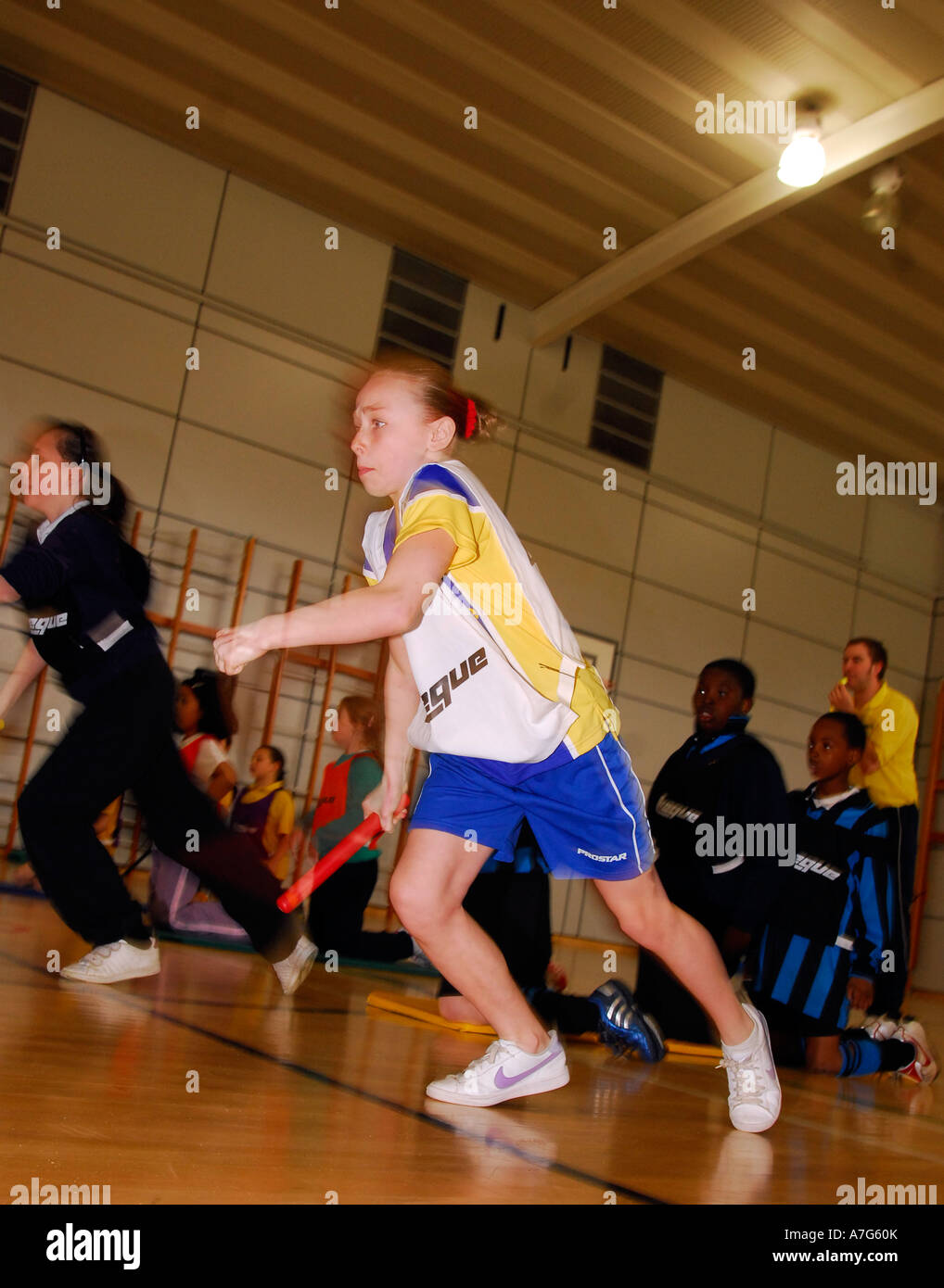 School pupils taking part in a inter school indoor athletics event
